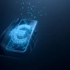 Digitale Euro-Symbol leuchtet auf einem Smartphone in einer Hand. Dies veranschaulicht, was ist der digitale Euro: eine neue Form des Geldes.