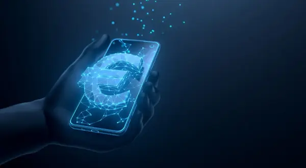 Digitale Euro-Symbol leuchtet auf einem Smartphone in einer Hand. Dies veranschaulicht, was ist der digitale Euro: eine neue Form des Geldes.